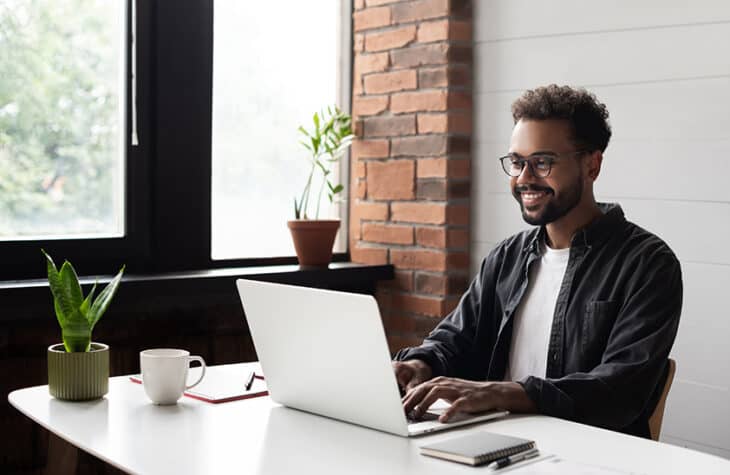 A young man working on his laptop